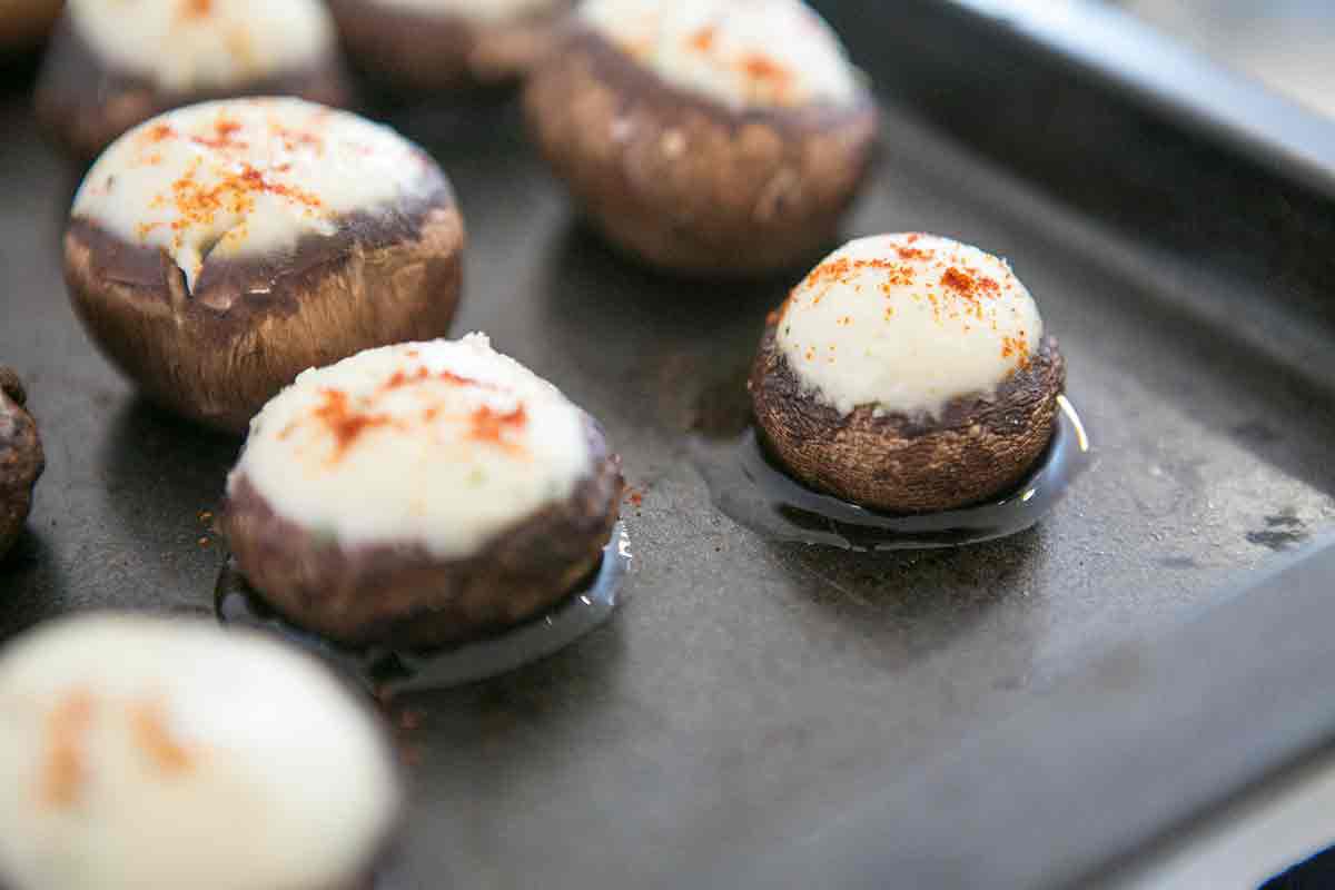 boursin stuffed mushrooms baked on baking pan