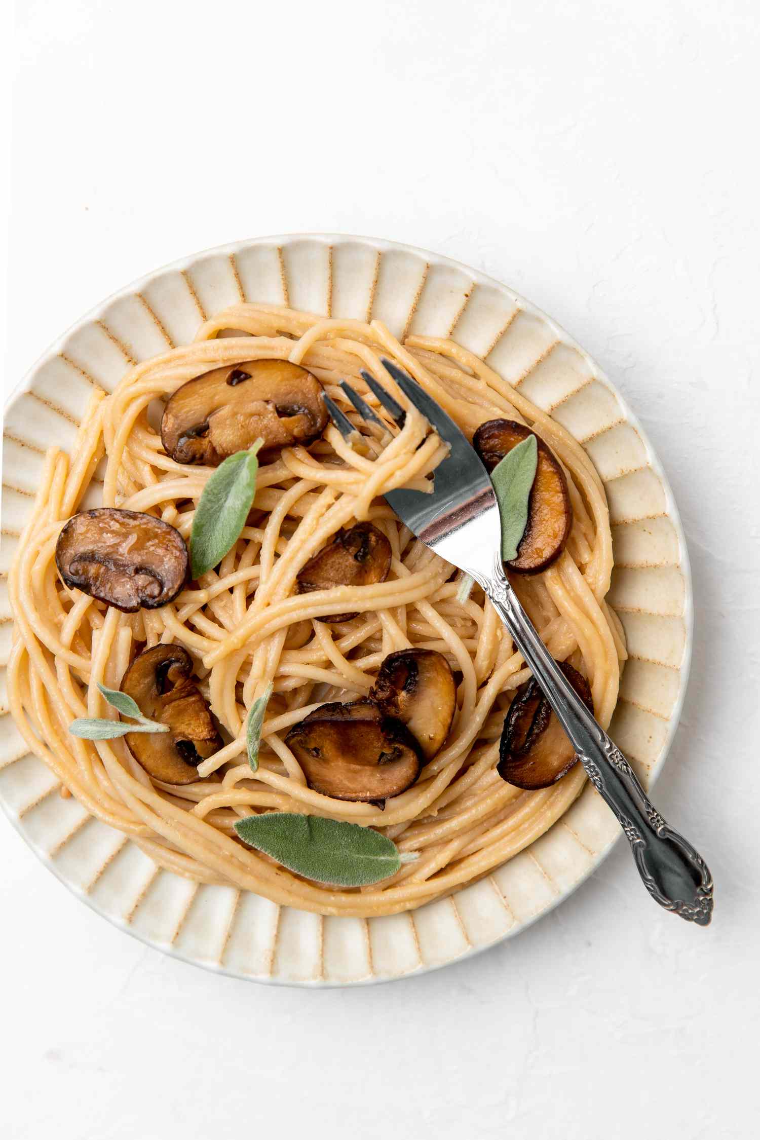 Creamy Miso Mushroom Pasta on a Plate with a Fork