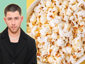 Nick Jonas next to a bowl full of popcorn