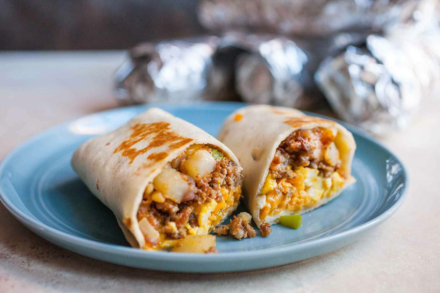 breakfast burrito on a blue plate