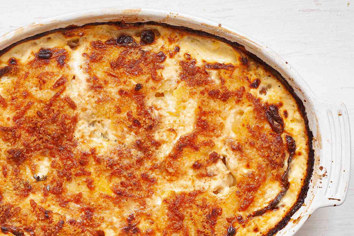 Au Gratin Potatoes baked in a casserole dish until golden brown.