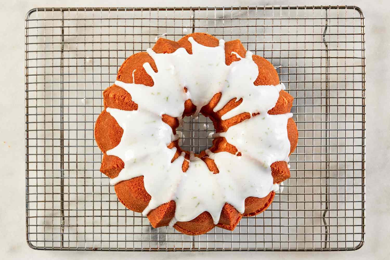 glaze added to 7UP bundt cake on the cooling rack 