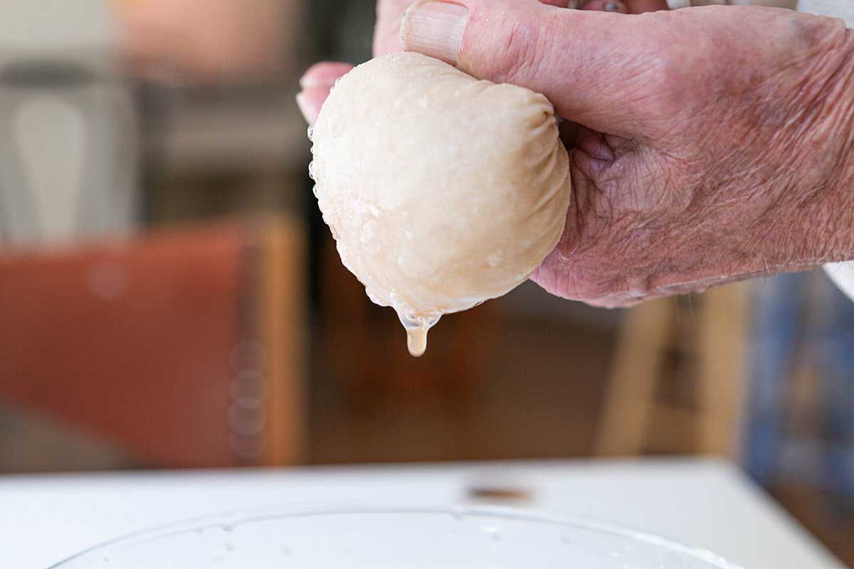 Shaved potatoes having moisture squeezed out through a cheese cloth