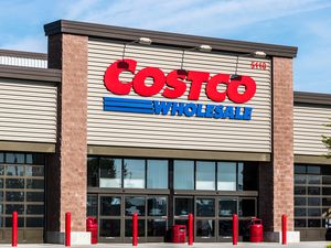 Front entrance of a Costco Wholesale store with prominent signage