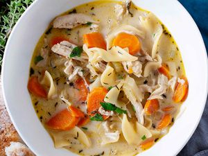 A bowl of creamy chicken noodle soup