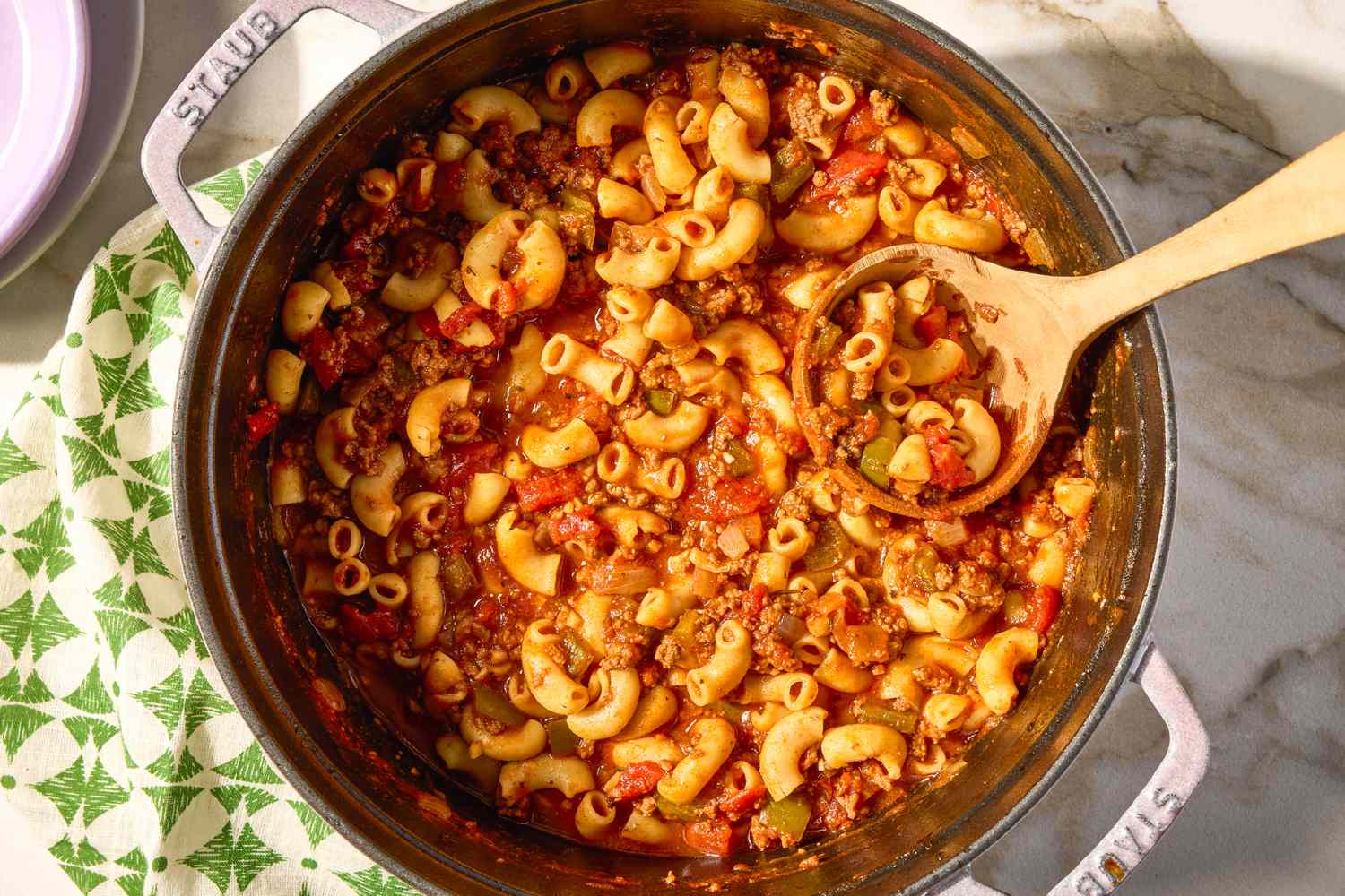 overhead view of a pot of American Chop Suey with a ladle