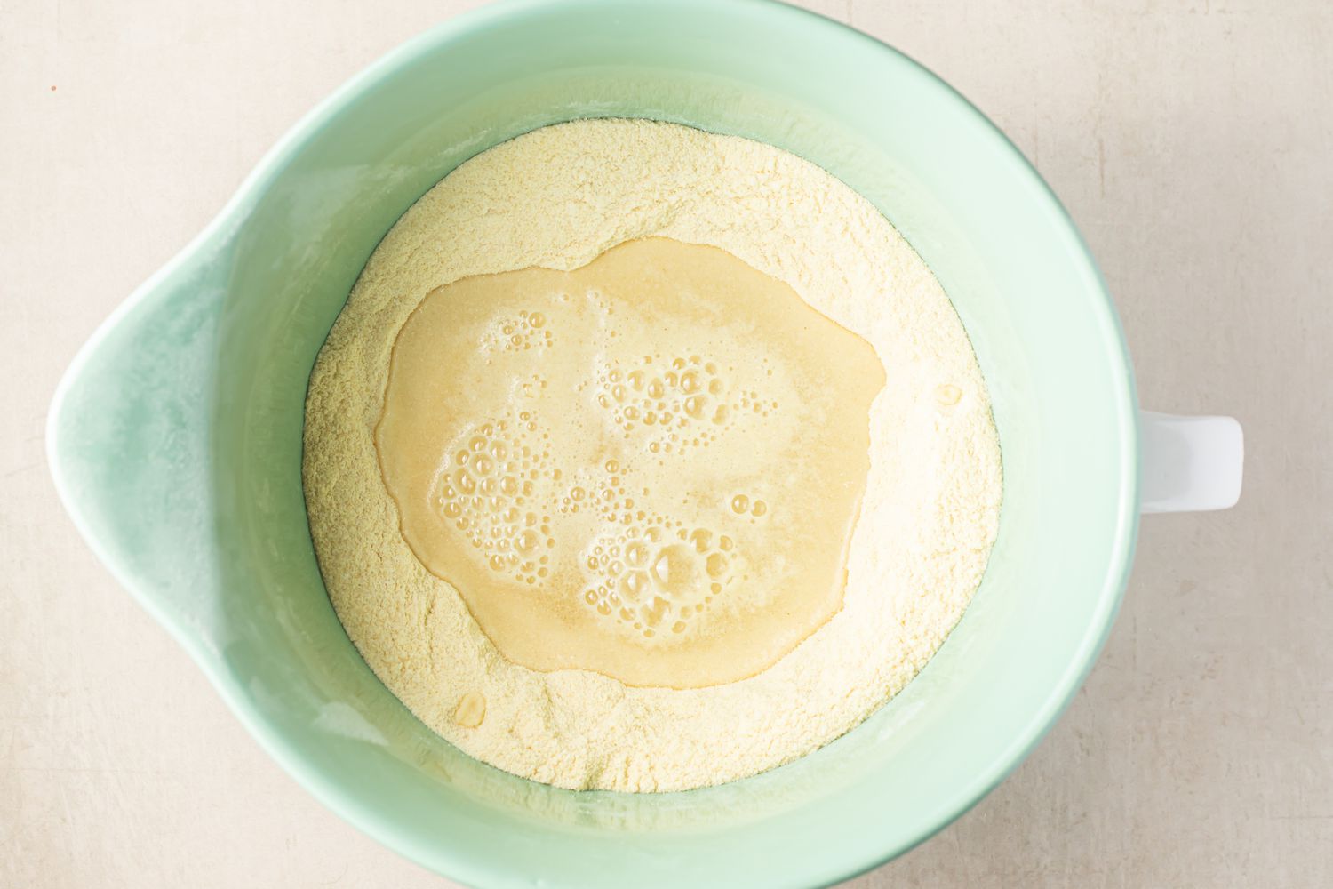 Ceramic Mixer Bowl Filled With Semolina and Water for Homemade Cavatelli Recipe