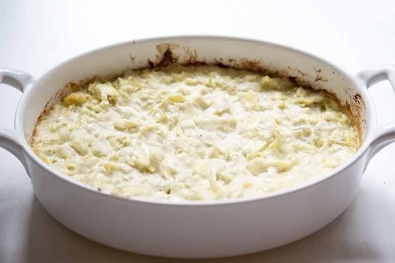 Fully Cooked Easy Artichoke Dip Recipe in White Baking Dish