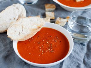 Best Tomato Soup Recipe - bowls of tomato soup on table with bread