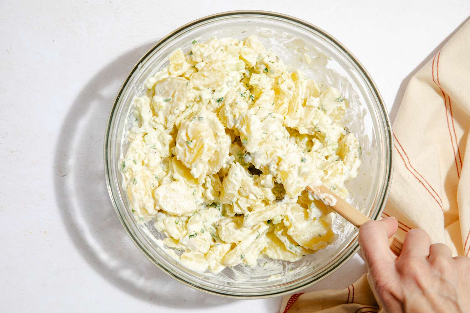 Stirring Julia Child's potato salad