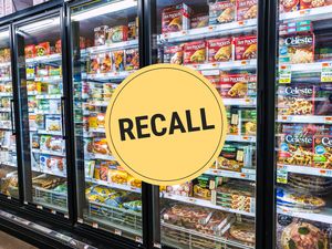 Supermarket frozen food aisle with a recall sign overlaid