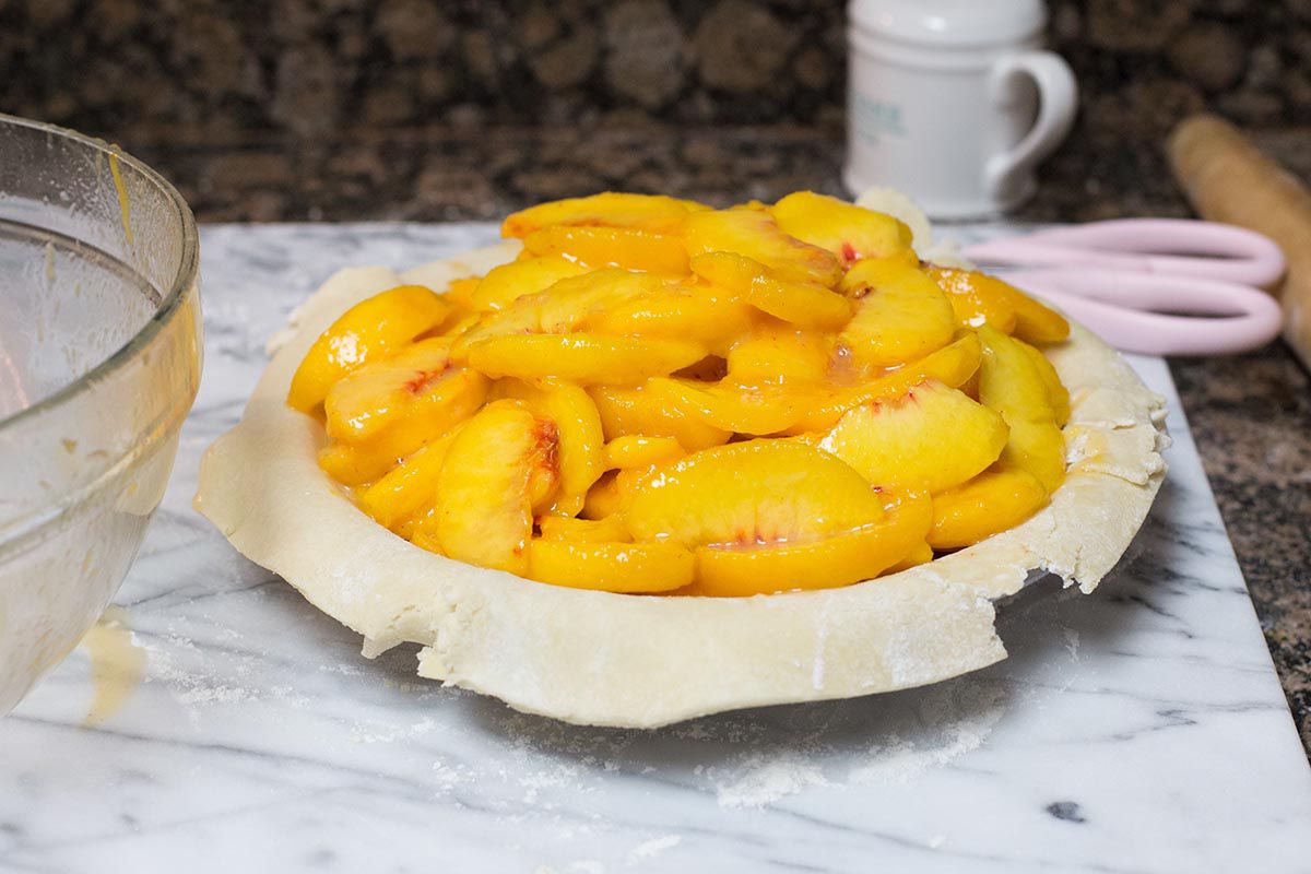 Peach Pie filling inside the pie crust