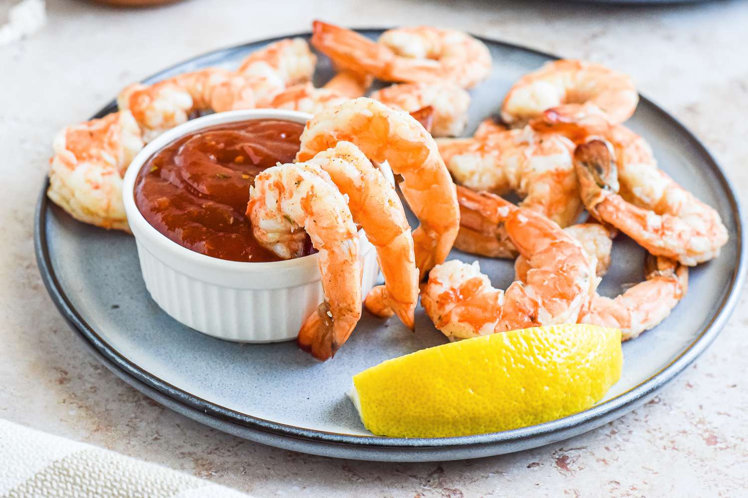 Shrimp Cocktail + Shrimp Cocktail Sauce served on a platter