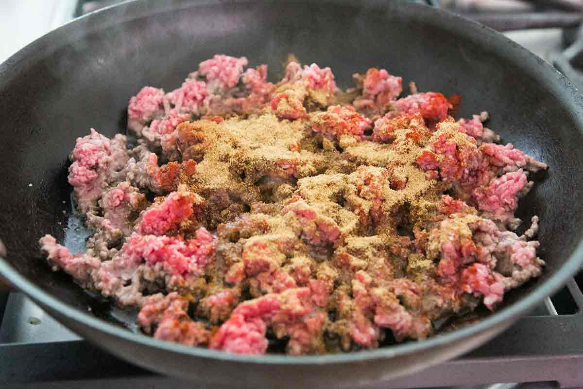 Add the spices to the beef as it browns