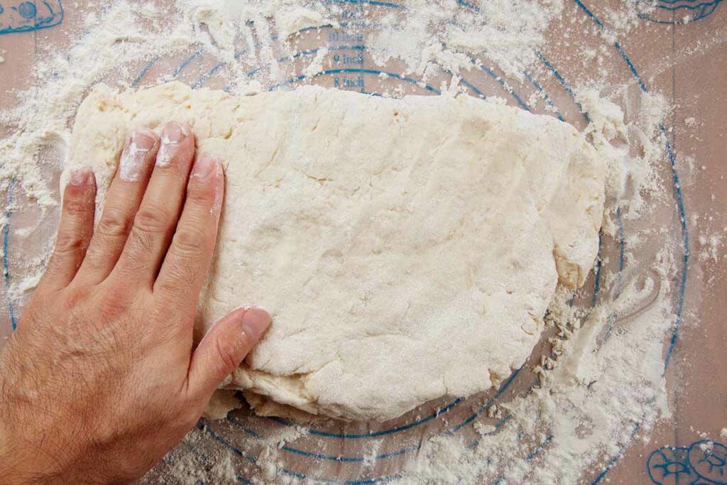Fold angel biscuit dough then pat