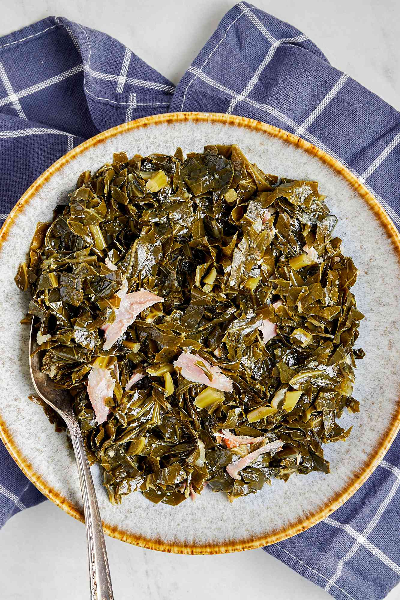 Instant Pot Collard Greens on a Plate with Serving Utensil