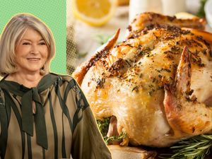 Martha Stewart next to a dish of roasted chicken