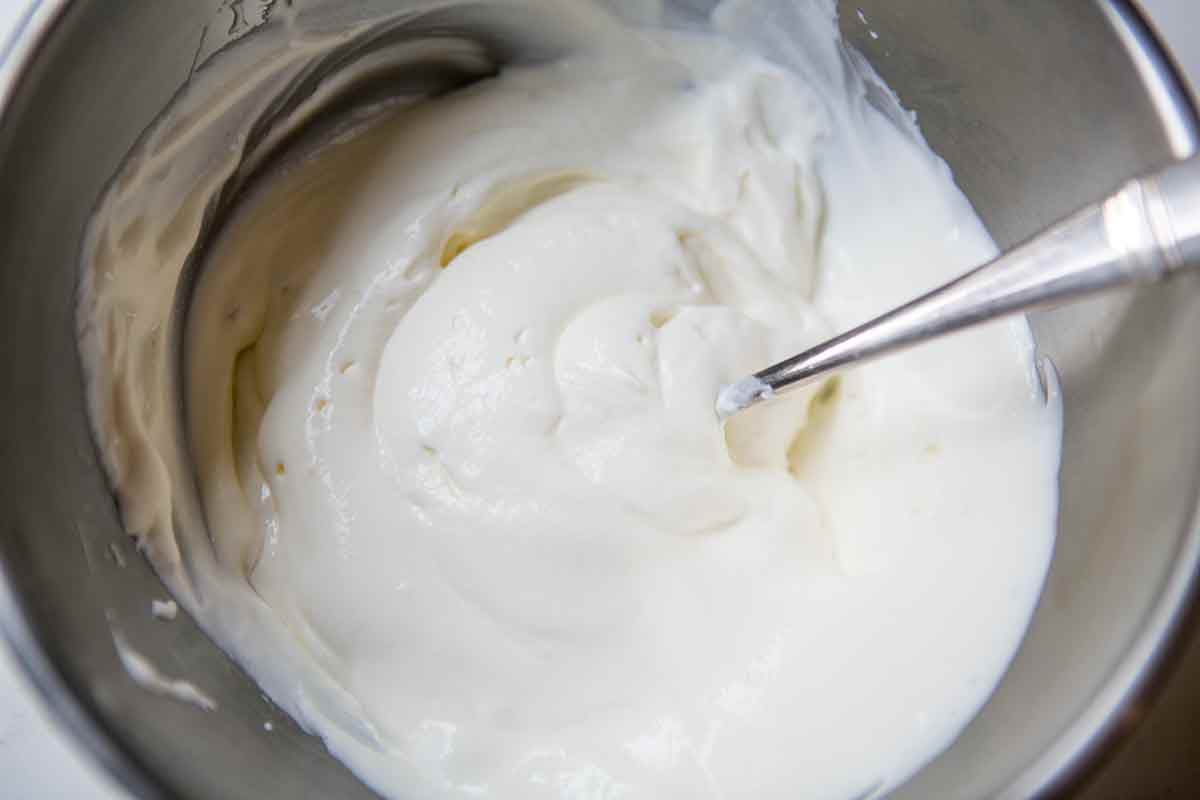 Mix together the sour cream and the baking soda for the fruit cake recipe