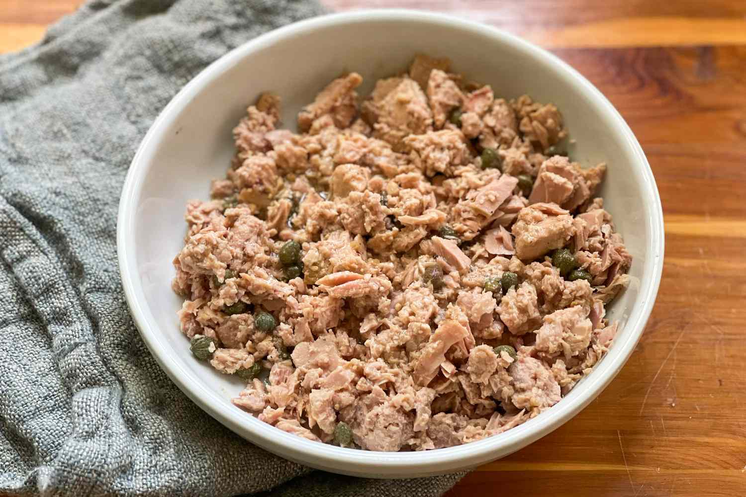 3-ingredient tuna salad in a bowl next to a kitchen towel