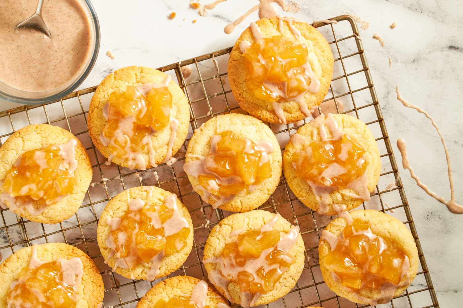 Apple pieinspired cookies with topping on a cooling rack