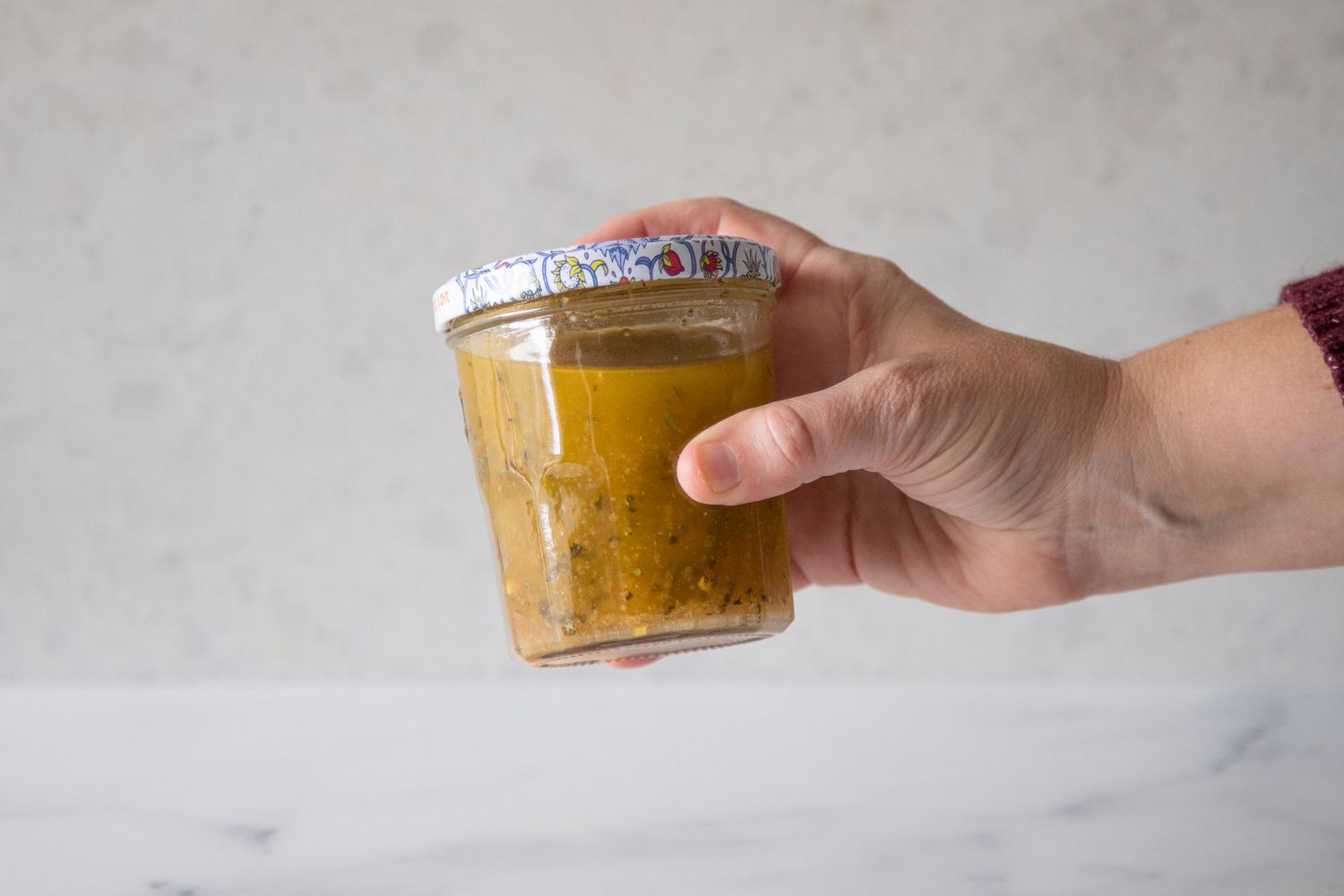 Vigorously shake jar of Italian dressing.