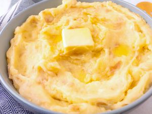 3-Ingredient Garlic Mashed Potatoes in a bowl topped with a pat of butter