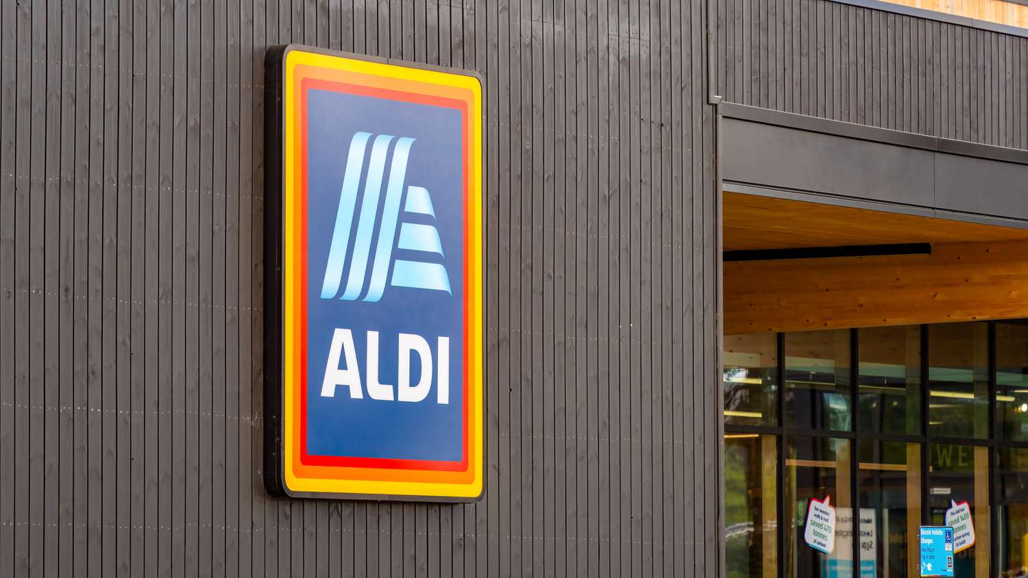An ALDI sign on a wooden wall