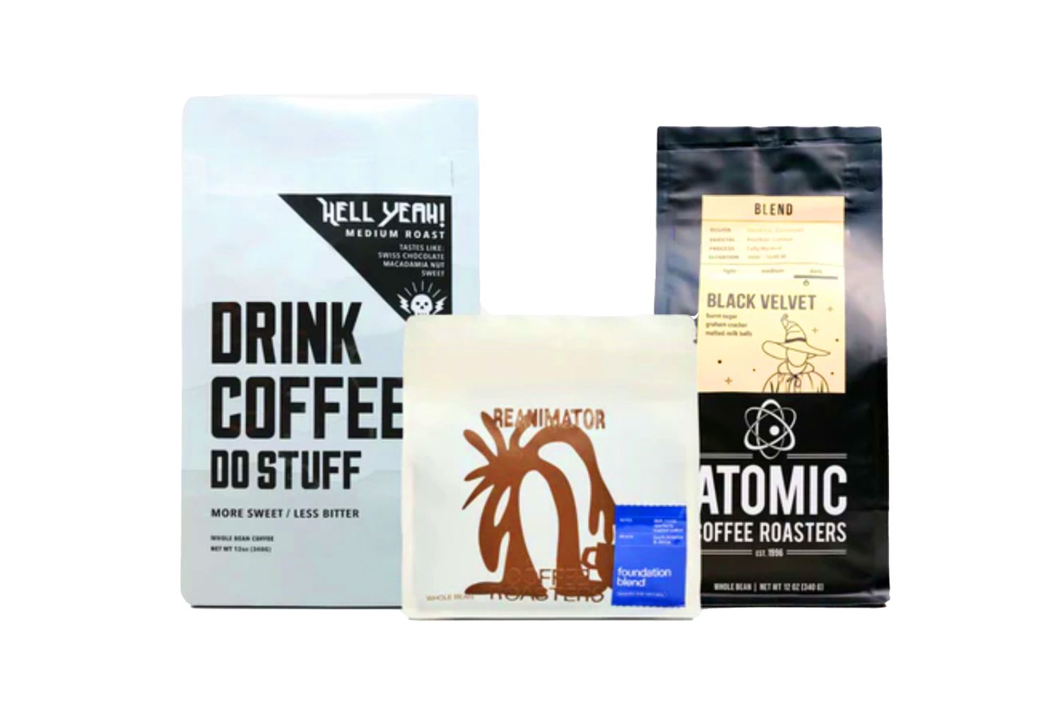 Three bags of coffee, one called "Drink Coffee Do Stuff," one called "Reanimator," and the third called "Atomic Coffee Roasters"