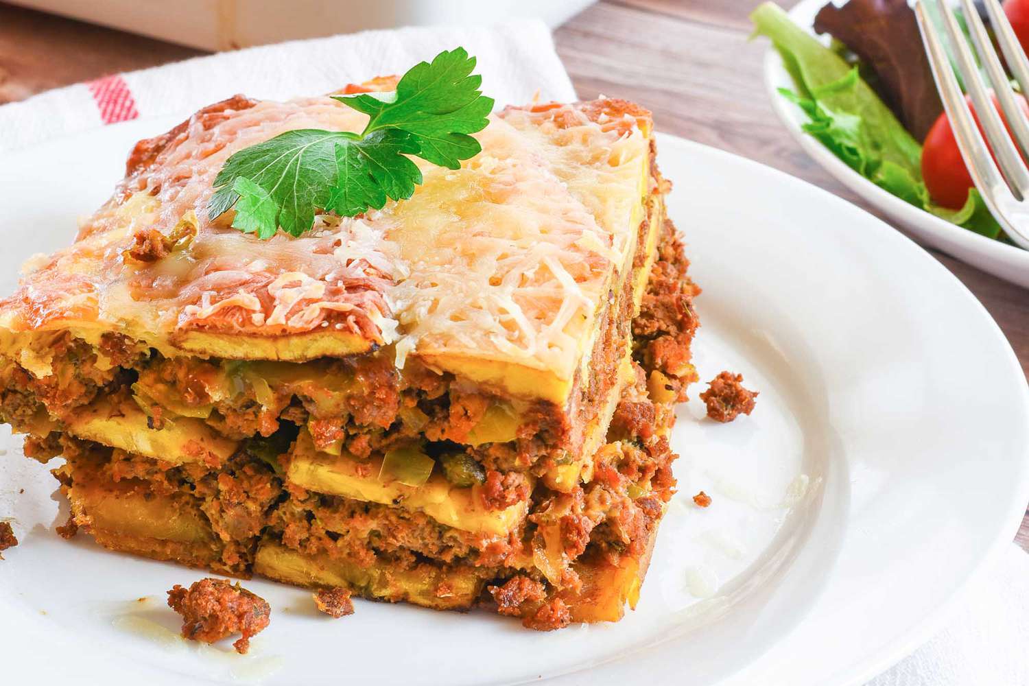 A large slice of pastelon on a plate