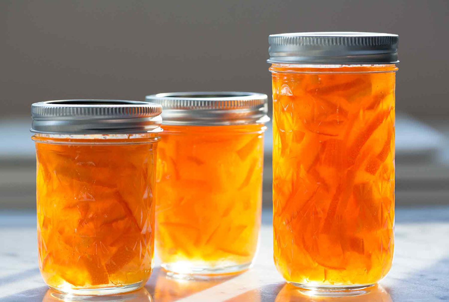 Jars of homemade orange marmalade after canning