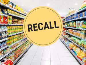 Grocery store aisles with a large Recall label imposed in the center of the image