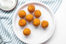 Potato Croquettes on a Plates on a Table Cloth