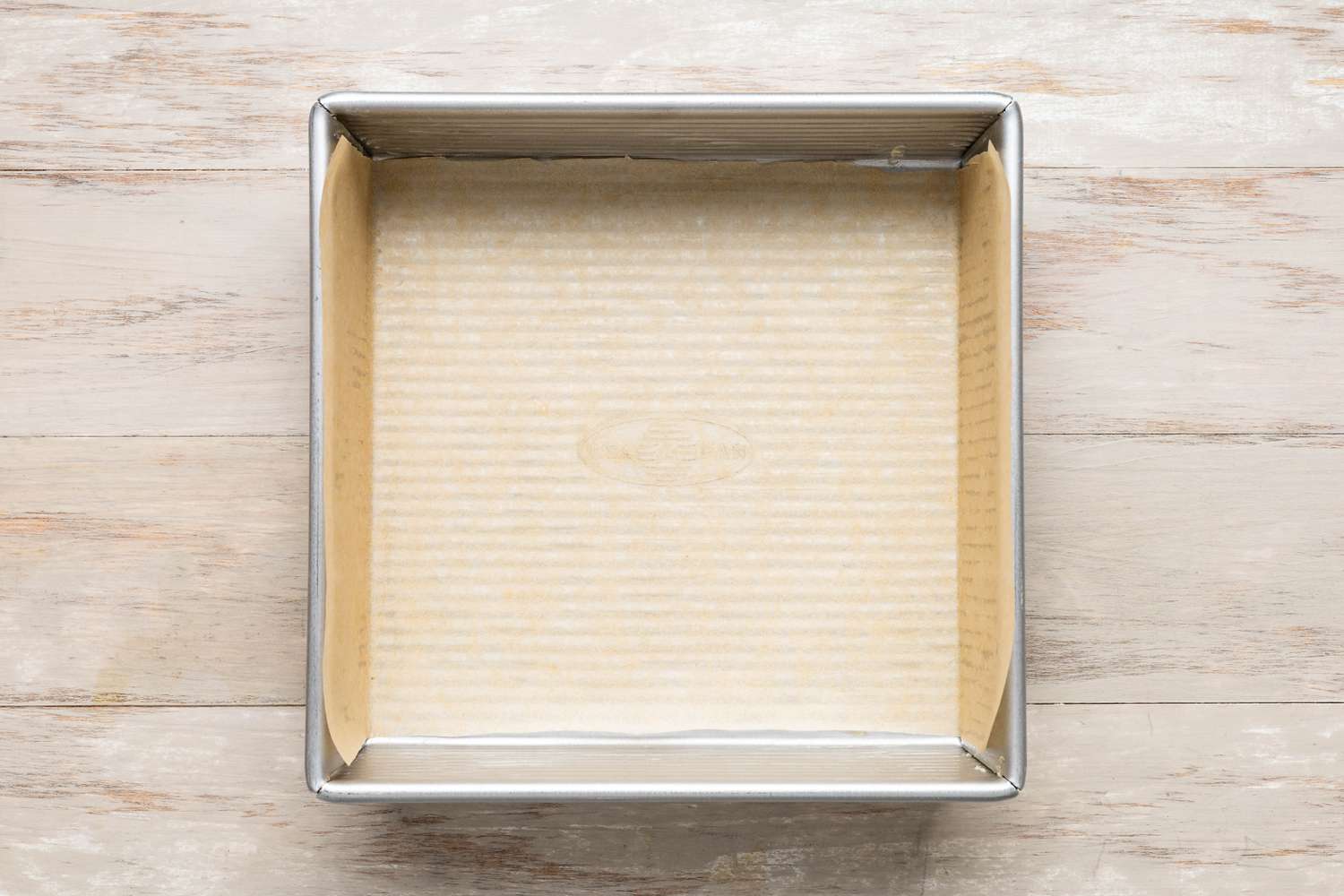 a square baking pan lined with parchment