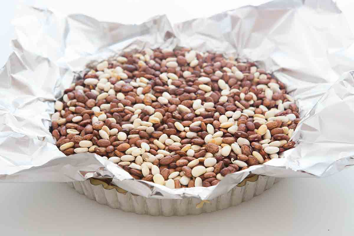 Beans as pie weights in crust in pan