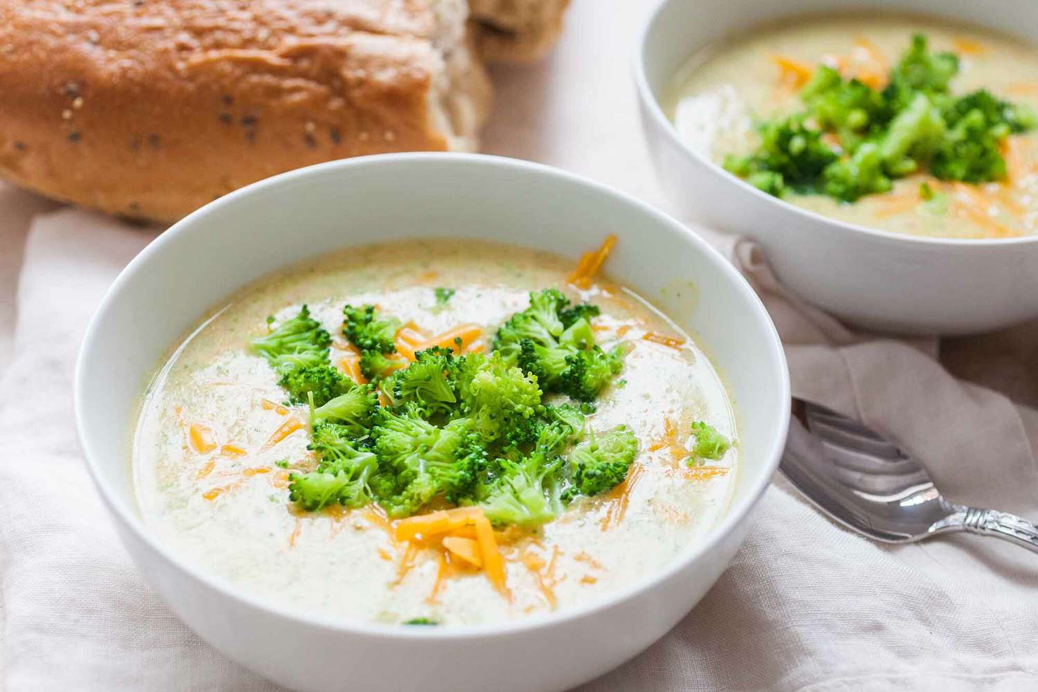 Broccoli Cheddar Soup Recipe served in bowls with bread
