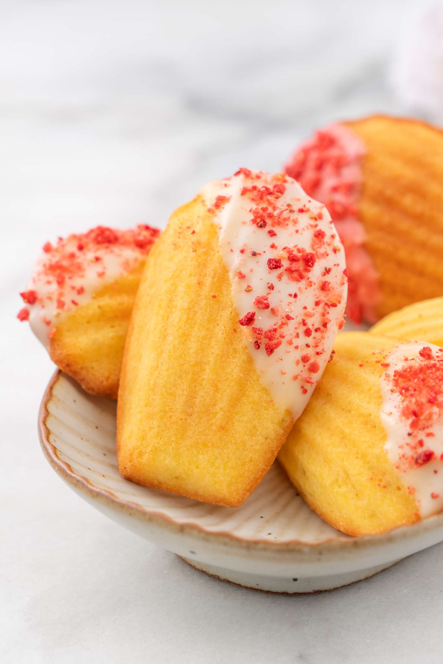 Madeleines dipped in glaze
