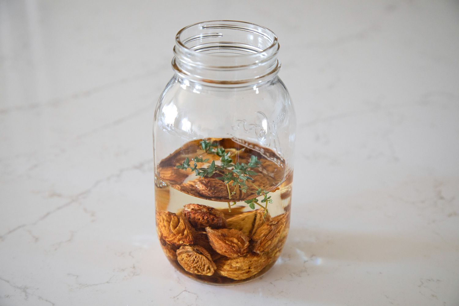 Infusing the vodka for 1 month for the stone fruit pit liqueur 