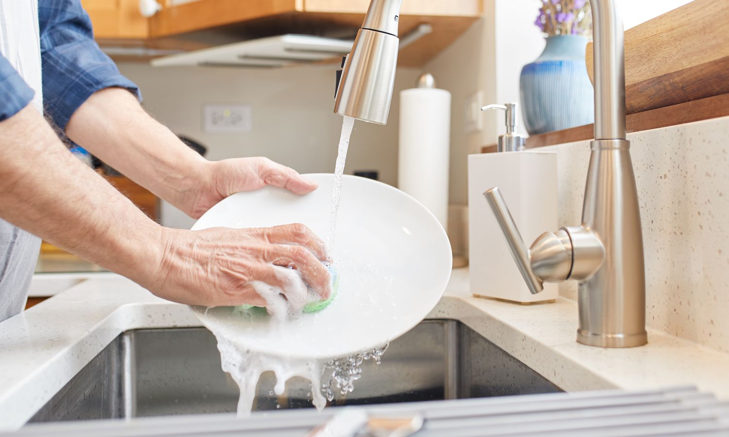 Washing dishes in sink