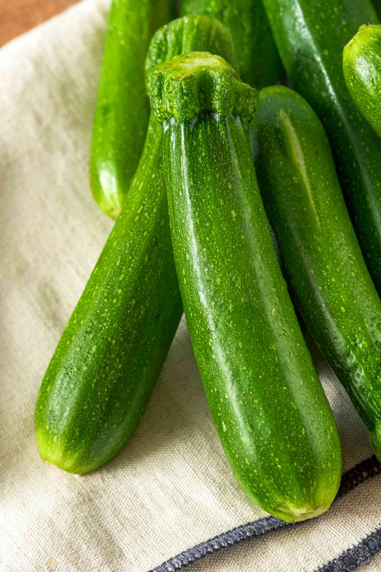 raw zucchini on a kitchen towel