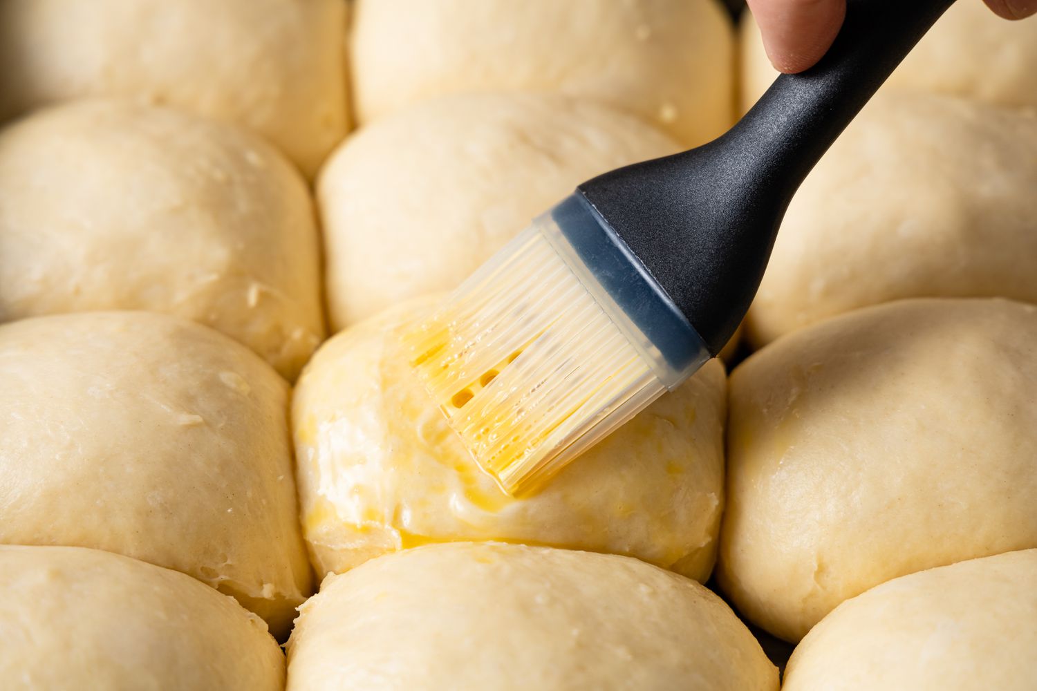 brush butter on dinner rolls
