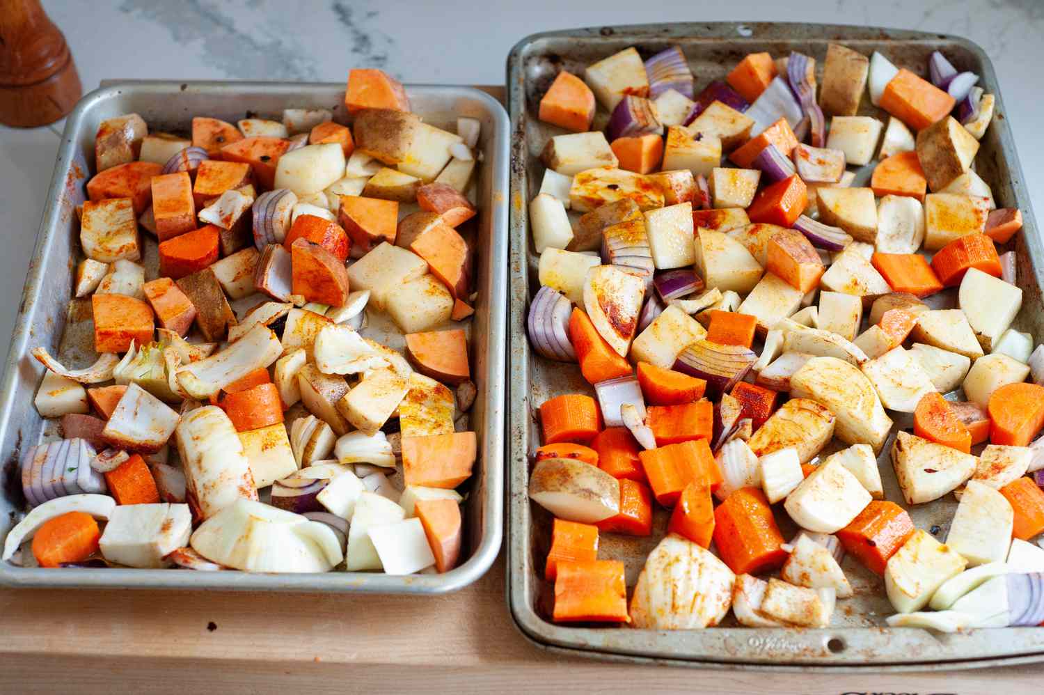 Two sheet pans filled with anytime roasted vegetables 