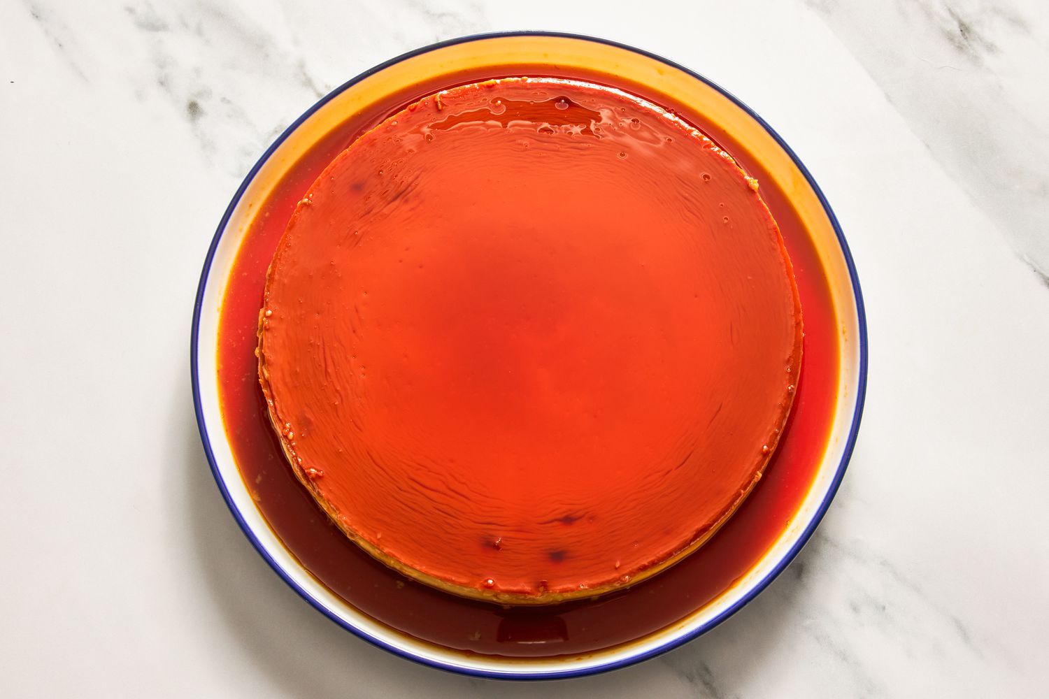 Flan on a plate topped with the caramel