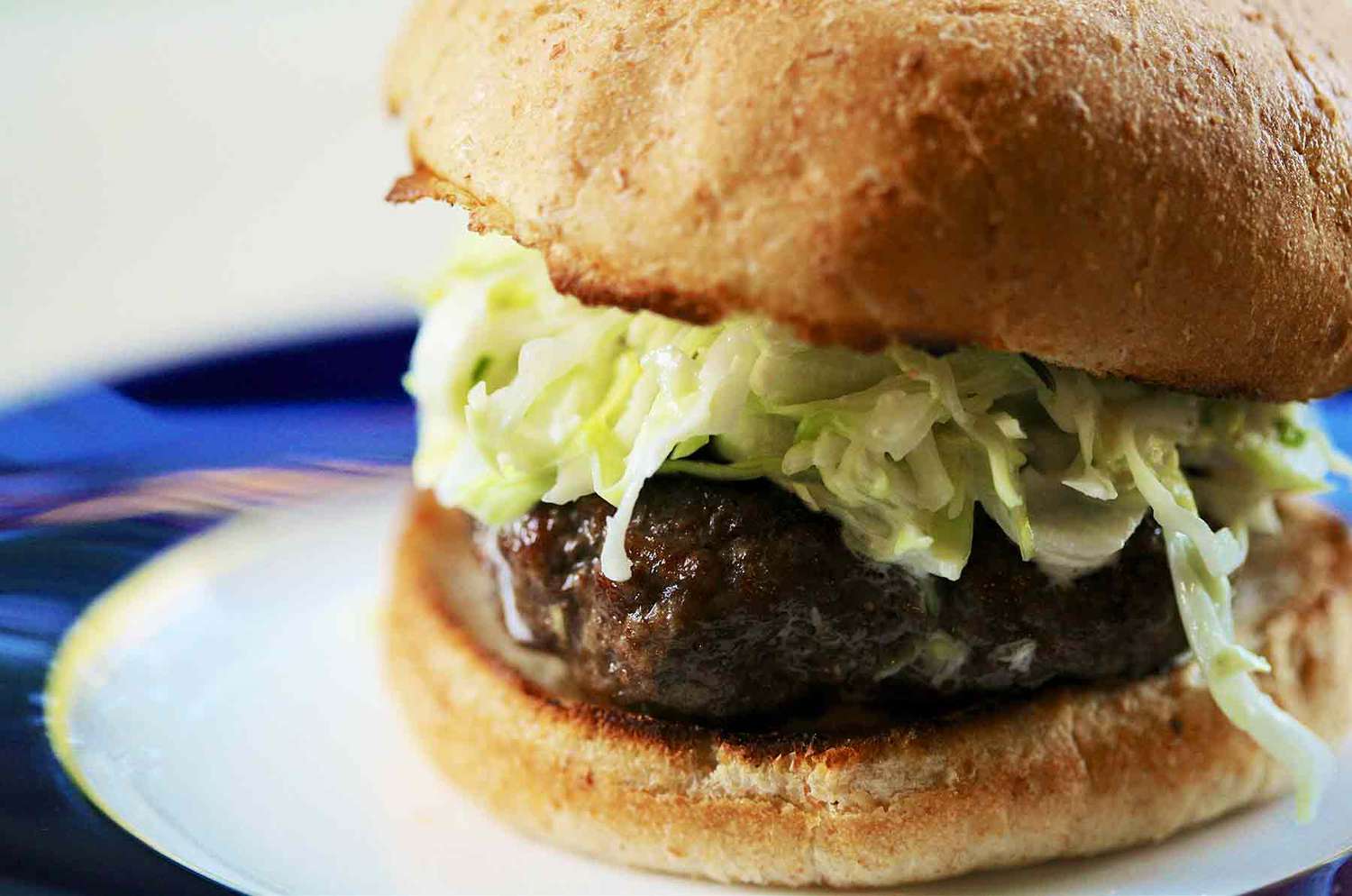 A side shot of a jamaican jerk burger