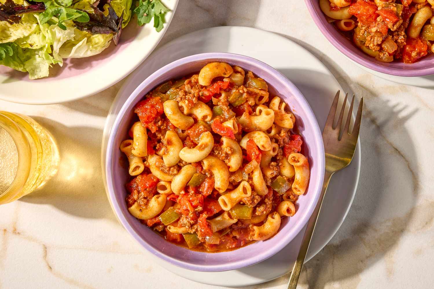 overhead view of a bowl of American Chop Suey with a fork