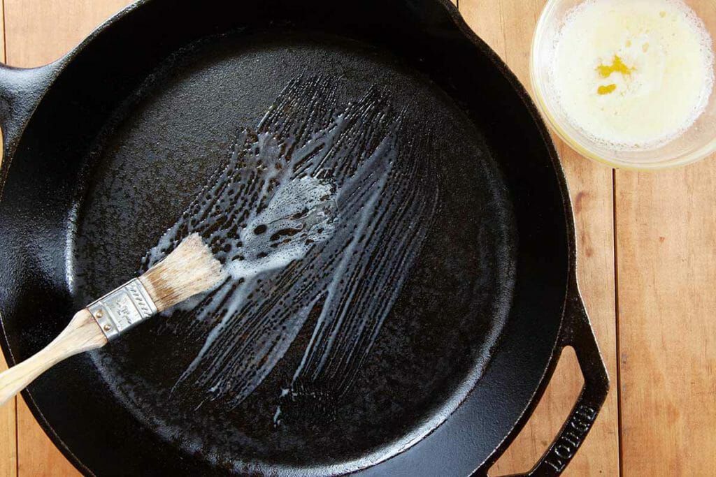Brush cast iron skillet with butter for angel biscuit recipe