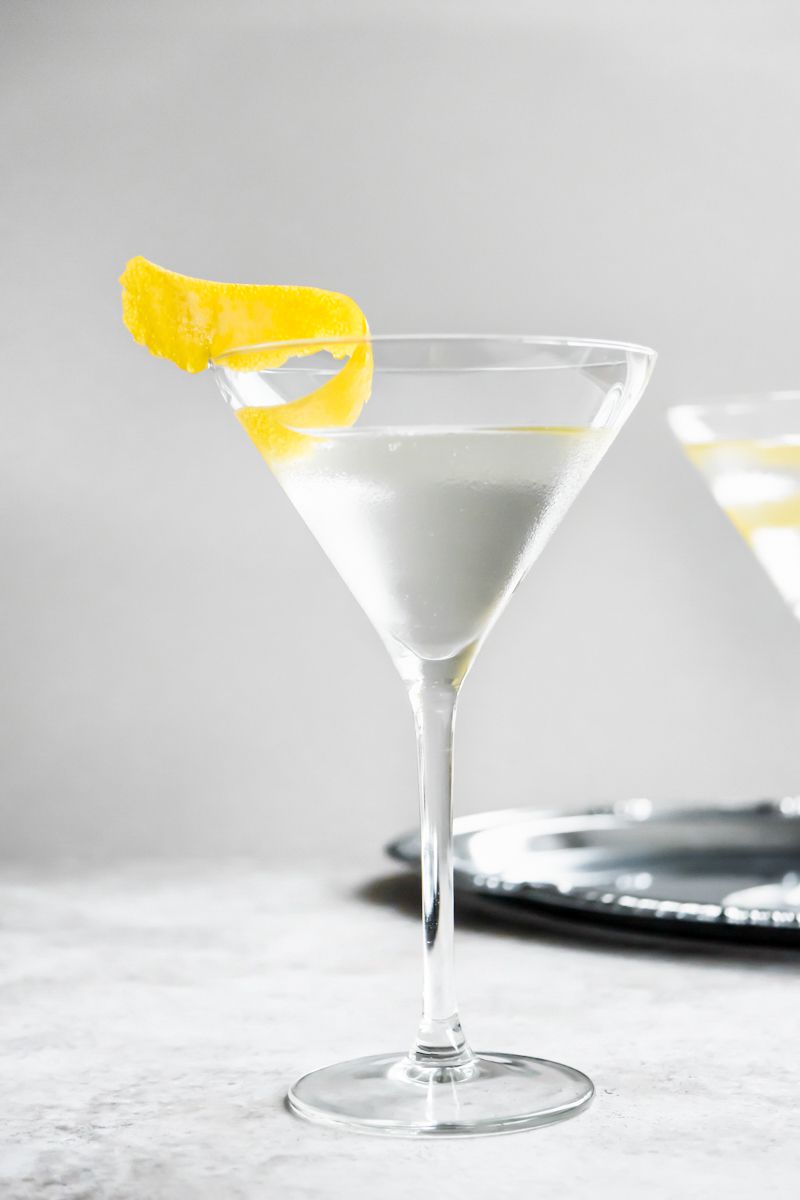 Vesper Cocktail on the Counter and in the Background, Another Glass on a Silver Tray