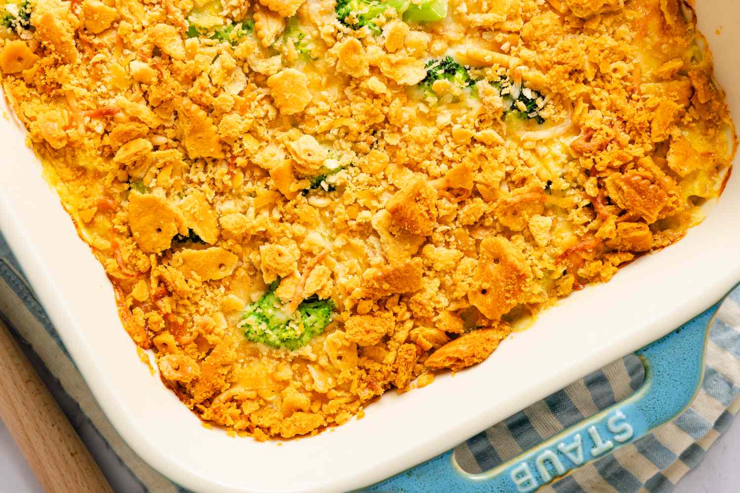 Closeup of a chicken divan casserole with a cracker topping in a rectangular dish