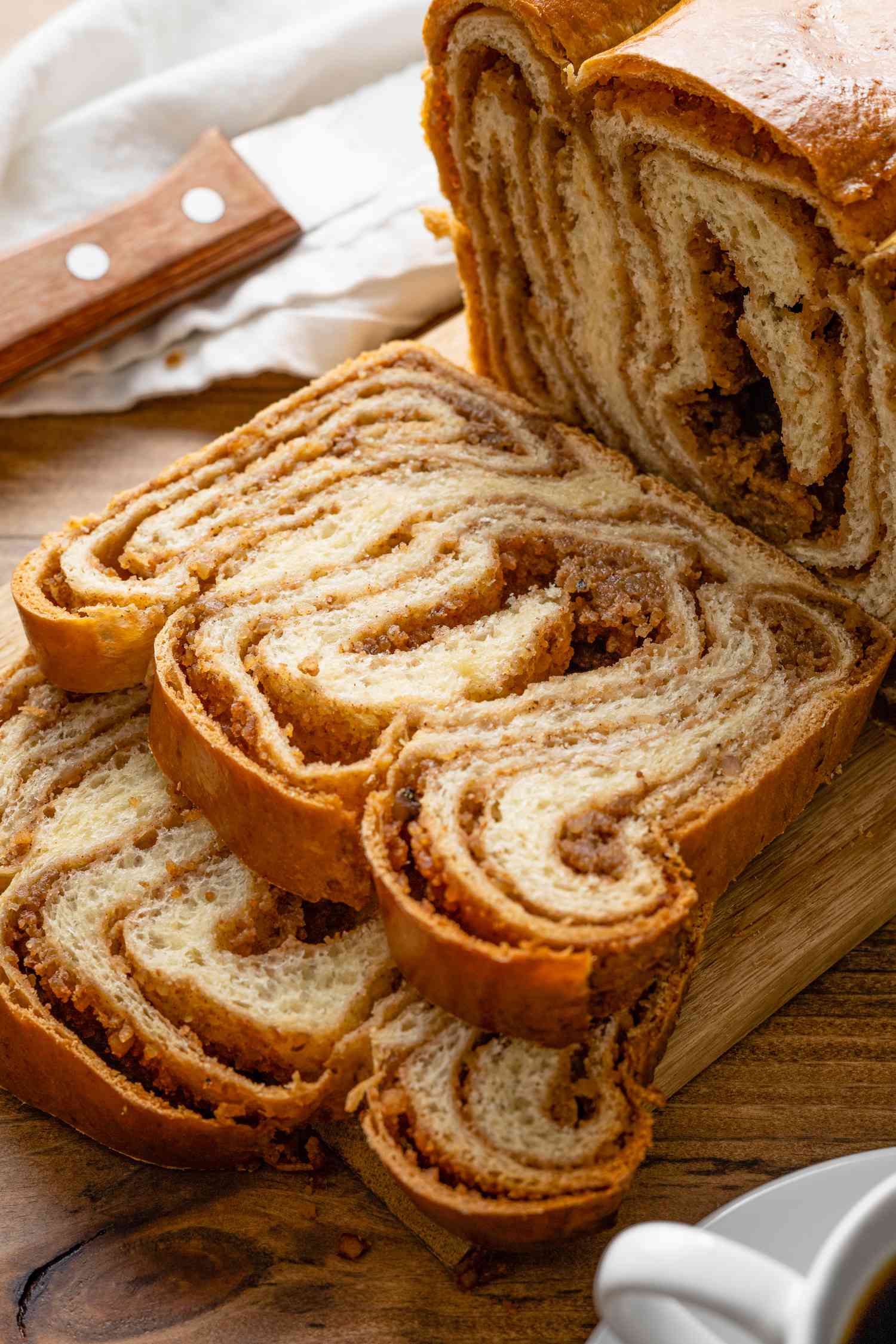 Slices of Povitica Next to the Loaf on a Cutting 