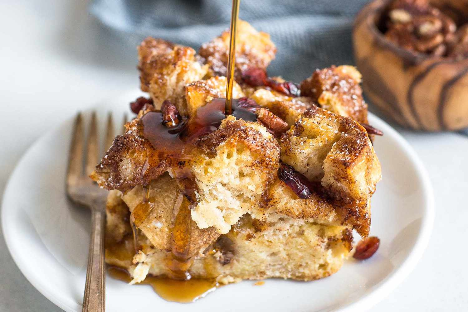 Syrup Being Poured On Square of Easy French Toast Casserole 