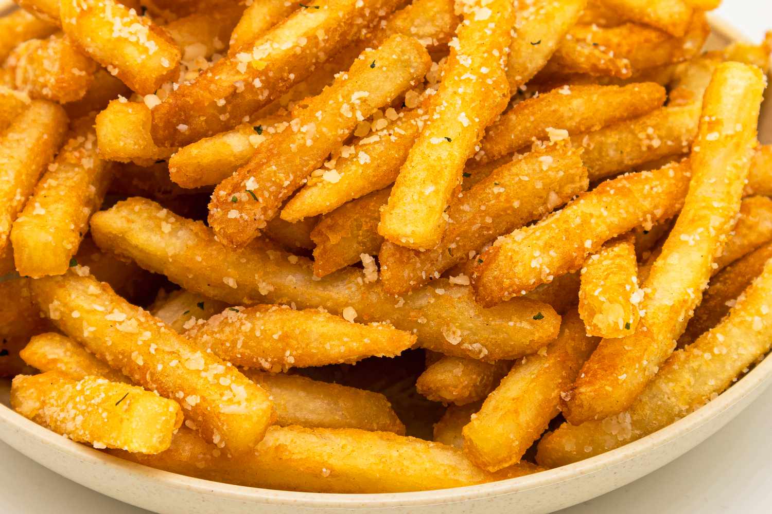 Closeup sof crispy French fries in a bowl